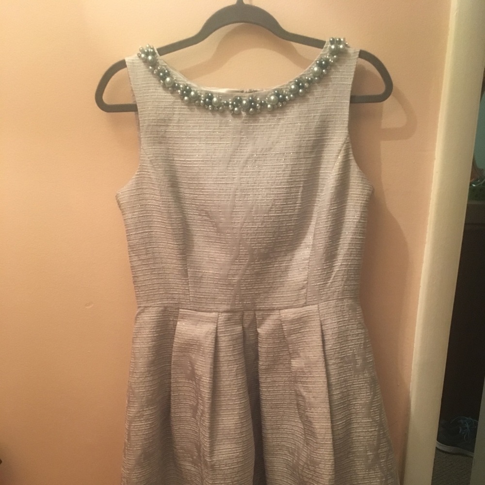 Beautiful dress with metallic and neckline detail!
